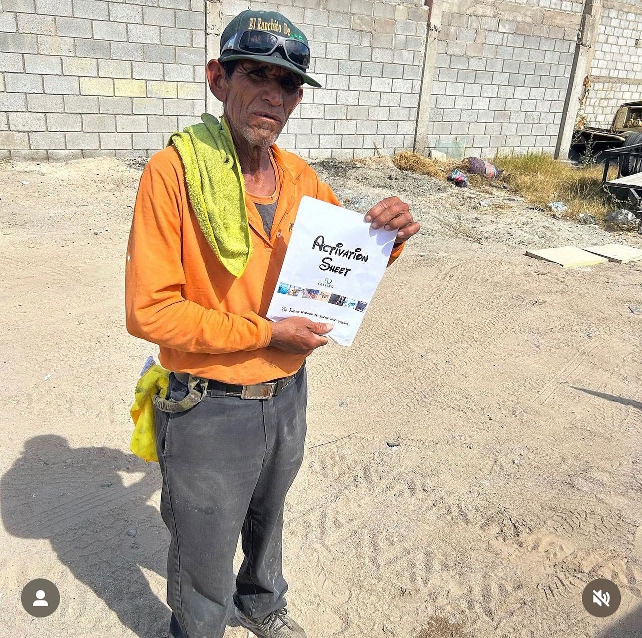 A participant at Ranchito holding The Calling Activation Sheet