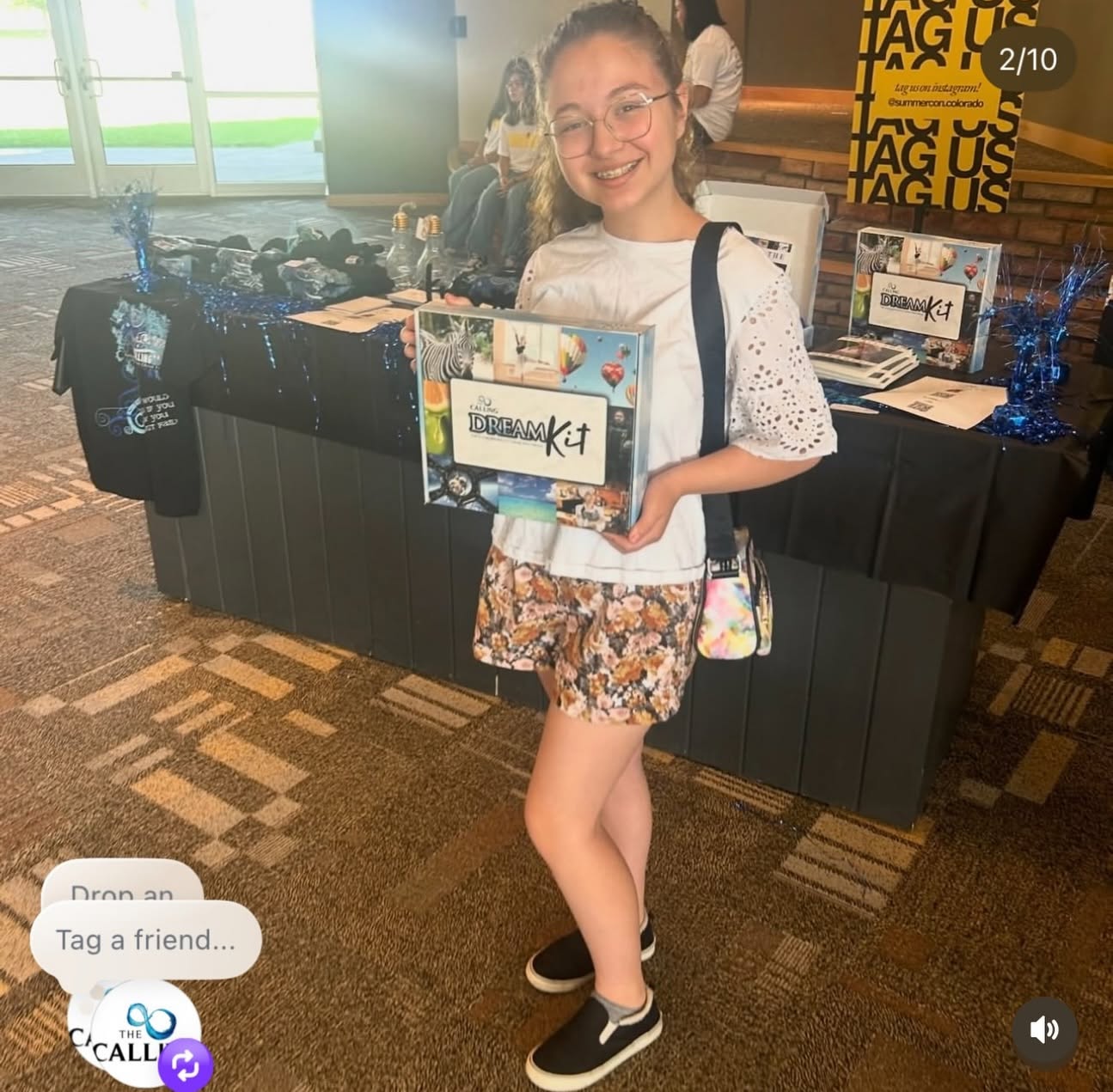 A young dreamer holding a Dream Kit at a Calling gathering