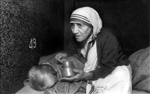 Mother Teresa feeding a man at the Home for the Dying, Mother Teresas Missions of Charity, Calcutta, India 1980 Mother Teresa: Untitled 39. 300A-034-026 The Home for the Dying. Calcutta, India 1980 Mother Teresa at the Home for the Dying, Mother TeresaÕs Missions of Charity, Calcutta, India, 1980 Photographs of Mother Teresa's MIssions of Charity in Calcutta: Untitled 39. The Friends of Photography 1985 ÒMother Teresa at The Home for the Dying, Calcutta.Ó Mary Ellen Mark: 25 Years. Bulfinch Press. Little Brown and Company 1991 ÒMother Teresa at the Home for the Dying, Mother TeresaÕs Missions of Charity, Calcutta, India, 1980Ó Life. July 1980. pp. 54 and 55 ÒAt right, in the white sari that denotes her allegiance to IndiaÕs poor, Mother Teresa feeds a sick man.Ó Photojournalism in the 80Õs. Hillwood Art Gallery. October 1985. pp. 17